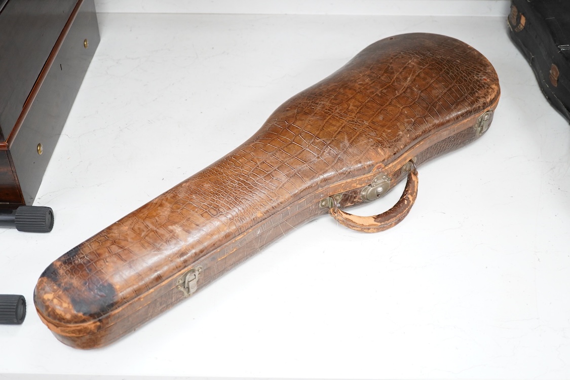 A late 19th century German violin after Pablo Maggini in bird’s eye maple with a fully mounted German bow in a crocodile skin case with retailers ivorine label reading; ‘Edward Withers, 22 Wardour Street, phone City 1899
